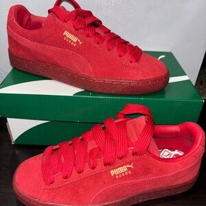 Puma Suede Low-Top Sneakers in Bright Red with Gold Logo
